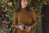the Tia turtleneck in earth